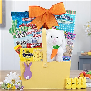 An Easter basket with carrots hanging across the front has a 6" plush bunny and Easter treats.