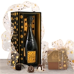 A bottle of Veuve La Grande Dame Champagne and a box of handmade truffles