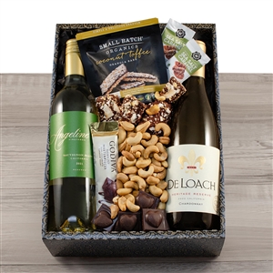 A bottle of Chardonnay and Sauvignon Blance nestled in a gift box with truffles and chocolates