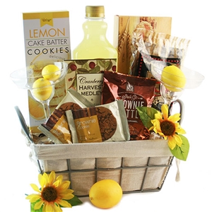 A basket with Margarita mix, margarita glasses and treats
