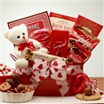 Red metal pail filled with Valentines Treats including a plush bear