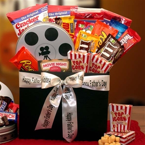 Fathers Day Ribbon around a gift basket with movie candy and movie themed packaging includes a $10 Red Box Gift Card