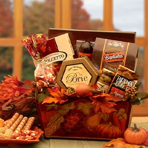 An embossed metal tray filled with favorite snacks and bright autumn colored leaves