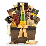 Leather trimmed gift basket with a bottle of Veuve Clicquot champagne and gourmet chocolates and more