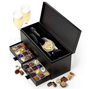 Dom Perignon Champagne and Chocolates boxed together in an elegant box with a drawer for the chocolates