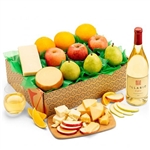 A bottle of white wine, fresh orchard fruit and cheese presented in a gift box