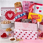 Valentines Day Care Package comes in a pretty pink box, filled with candy and popcorn