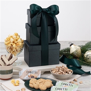 A gift tower of 3 elegant gift boxes in classic colors filled with an assortment of Gourmet Snacks.
