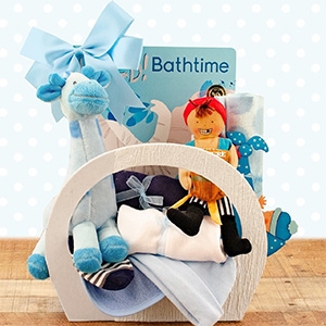 A basket for the new baby boy that includes baby sleeper, socks, cap, receiving blanket, bib and more!