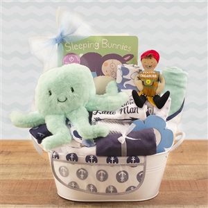 A metal tin basket loaded with all the necessities for the new baby boy!