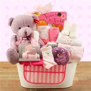 Lovely basket with items to pamper the new baby girl.