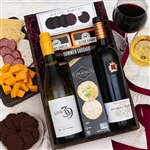 Wood crate tray with a red wine a white wine and picnic fare