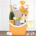 Yellow Label Veuve Clicquot Champagne Basket accompanied by chocolate delights.