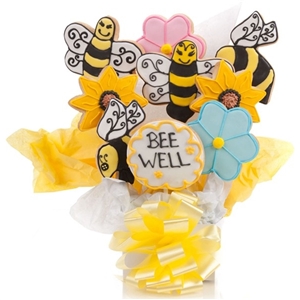 A vanilla sugar cookie arrangement with shapes of bees and flowers, and your own personalization on a cookie to customize for any occasion.