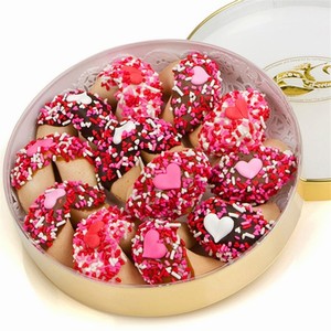 One dozen chocolate dipped fortune cookies decorated with hearts and sprinkles with romantic fortunes inside.